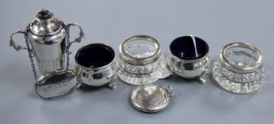 A pair of George V silver salts with liners, a pair of silver mounted glass salts, a silver pill