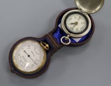 A pocket barometer by Armstrong, Manchester, cased and a nickel cased 'watch' type pocket