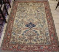 A Kashan ivory ground carpet 204 x 138cm