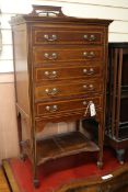 An Edwardian mahogany banded and inlaid mahogany music cabinet, fitted five fall front manuscript