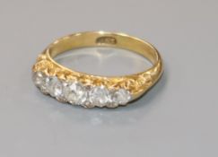 A yellow metal and graduated five stone diamond ring, size J.
