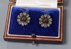 A pair of early 20th century 9kt gold, ruby and rose cut diamond set flower head earrings, 13mm.