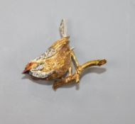 An 18ct gold, diamond and ruby brooch in the form of a perching bird, 27mm.