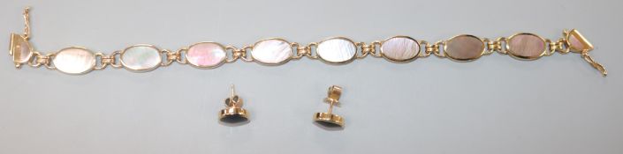 A 9ct gold and mother of pearl oval link bracelet and a pair of stud earrings en suite, cased.