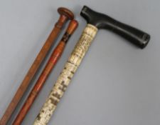A carved bone walking stick, a red lacquer stick, a wine measure and a mask
