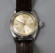 A lady's stainless steel Rolex Oyster Precision manual wind wrist watch, on associated leather