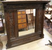 A late Victorian carved oak framed wall mirror H.117cm