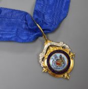 An 18ct gold and enamel 'Manchester Chamber of Commerce' medallion, with sash.