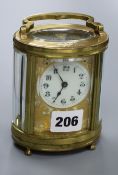 A brass oval French 20th century carriage timepiece