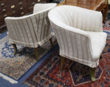 A pair of gilt framed tub chairs