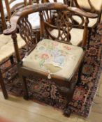 A George III mahogany corner elbow chair