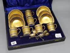 A set of six Limoges blue edged gilt porcelain coffee cans and saucers, together with a set of six