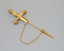 An early 20th century yellow metal 'dagger' jabot pin, 64mm.
