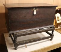 A small 18th century oak coffer on associated stand W.82cm