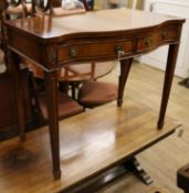 A George III style inlaid mahogany serpentine fronted two drawer serving table W.90cm