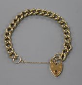 A 9ct gold curb link bracelet, with heart shaped padlock clasp.