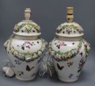 A pair of lidded floral encrusted vases converted to table lamps