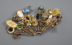 An early 20th century mixed metal including gold and gem set fan shaped brooch, modelled from