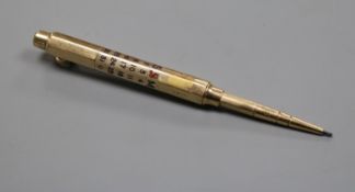 A Sampson Mordan & Co yellow metal and enamel cased calendar pencil.