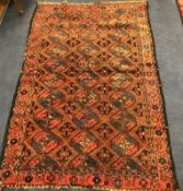 A Bokhara red ground rug 200 x 124cm