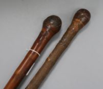 Two late 19th century carved Japanese bamboo walking canes