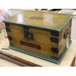 A wooden chest containing a plate tin train and accessories