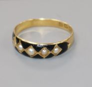 A late Victorian, 18ct gold, black enamel and seed pearl set half hoop ring, size Q.
