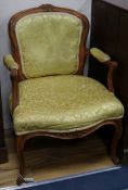 A French walnut upholstered elbow chair