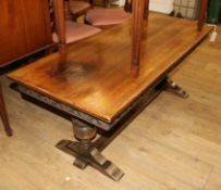 A reproduction low carved oak rectangular topped coffee table W.132cm