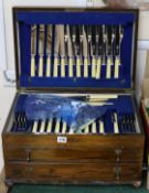 A 1920's oak canteen of plated flatware