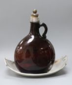 A Mexican 925 dish and a mounted coloured glass carafe.