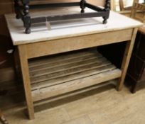 A pine two tier work table W.122cm