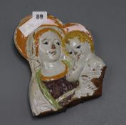 A 17th-18th century Italian majolica panel, mother and child