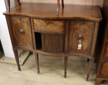 A George III banded mahogany and boxwood line inlaid serpentine fronted sideboard W.103cm