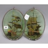 A pair of 19th century Spanish glass panels, painted with galleons, framed to the oval