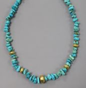 A single strand turquoise and yellow metal spacer necklace, with 750 clasp, 43cm.