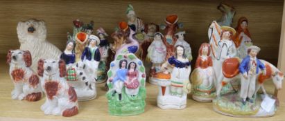 Thirteen Staffordshire figure groups and dogs