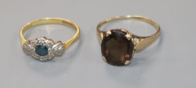 An 18ct gold, sapphire and diamond cluster ring and a 9ct gold gem set ring.