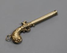 An early 20th century novelty engraved yellow metal cased propelling pencil, modelled as a pistol,