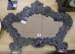 A late 19th century Italian plated and embossed cartouche shaped wall mirror length 72cm