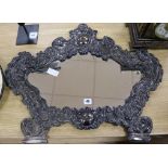 A late 19th century Italian plated and embossed cartouche shaped wall mirror length 72cm