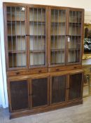 A 1920's leaded light oak library bookcase W.152cm