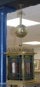 An early 20th century brass and stained glass hall lantern