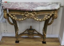A Louis XV painted parcel gilt console table W.130cm