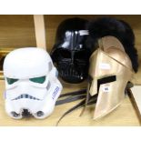 A Darth Vader helmet, Storm Trooper helmet and Roman helmet