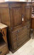 A linenfold carved cupboard / chest and a matching pair of bedside tables (3)