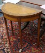 An Edwardian Sheraton revival inlaid satinwood demi-lune card table W.72cm