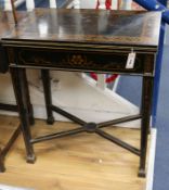 A painted ebonised folding card table W.70cm