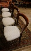 A set of four Victorian mahogany salon chairs, with balloon backs and turned underframes