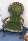 A Victorian walnut spoonback armchair